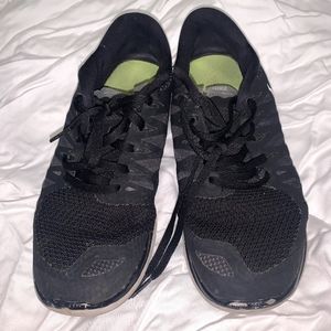 Well worn Nike athletic shoes